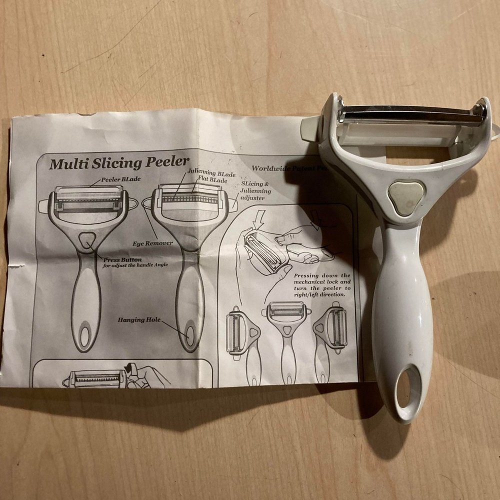 multi slicing peeler with adjustable head with paperwork